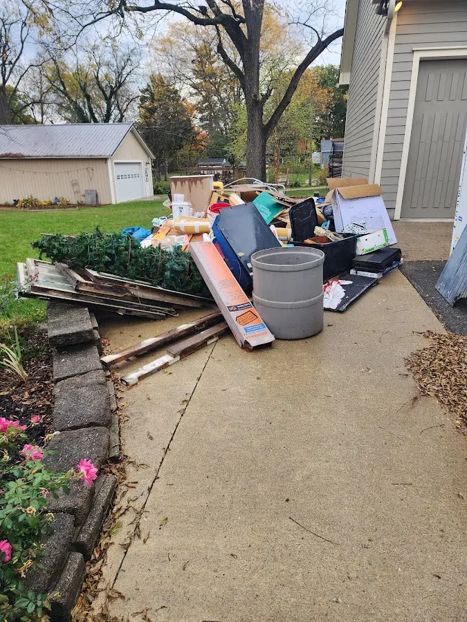 Dumpster being loaded with debris for Commercial Dumpster Rental in Cranberry